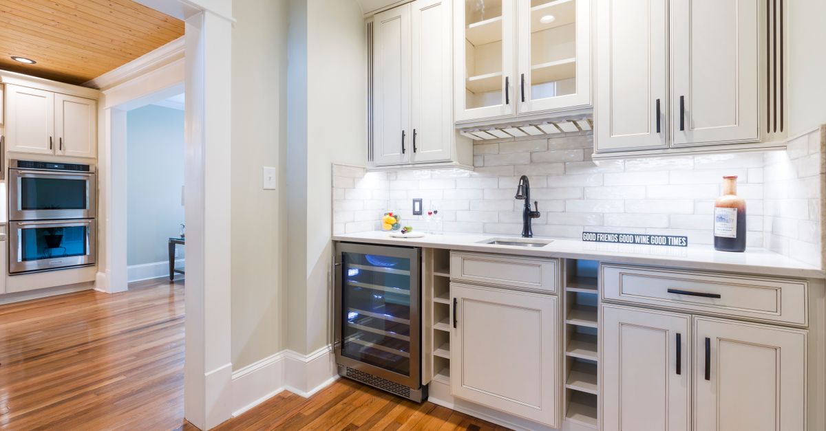Bright modern kitchen highlighting elegant wooden cabinets and sleek design.