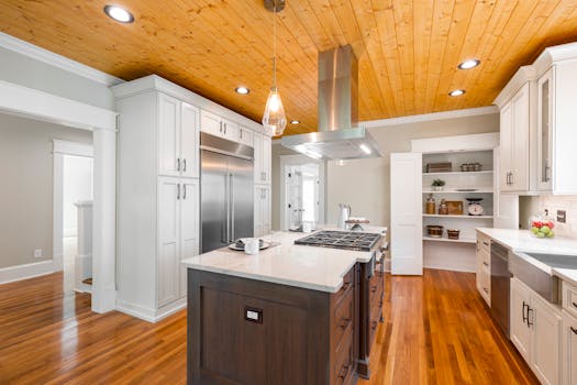 Spacious kitchen with wood accents, stainless appliances, and central island.