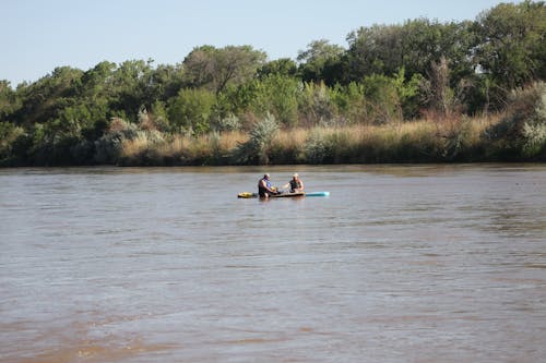 Men Riding Kayak on Lake