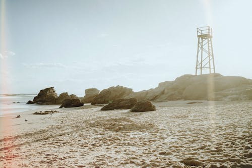 Free A Beach With a Lifeguard Tower  Stock Photo