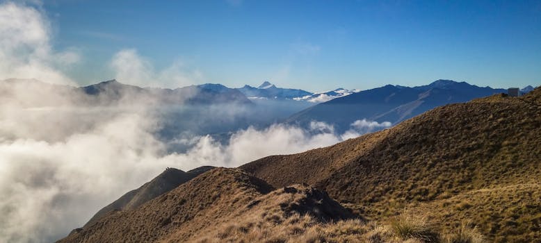Stunning panoramic view of mountains and clouds in Wanaka, New Zealand. Perfect for nature enthusiasts.