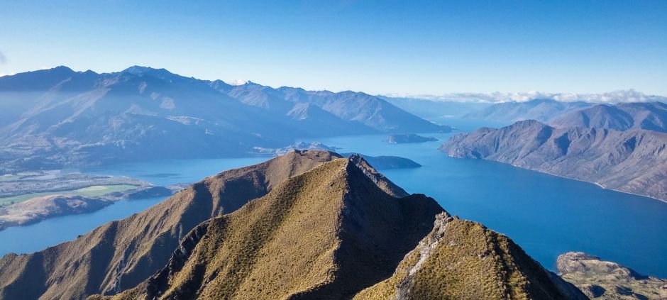 Unbeatable Queenstown: Pilot's Choice Helicopter Flight with Alpine Landing Review Review 2026 - A breathtaking panoramic view of mountains and Lake Wanaka in New Zealand.