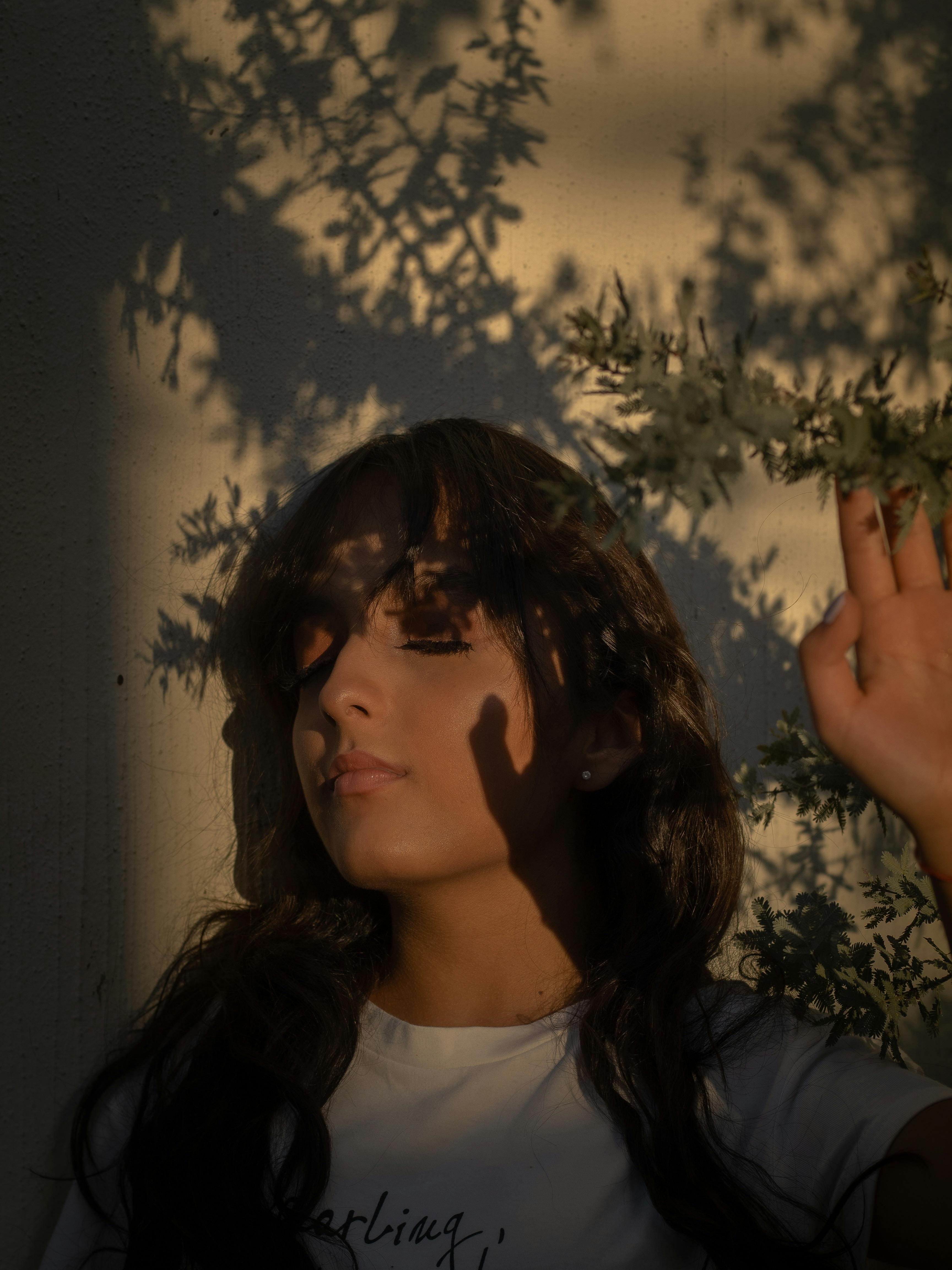 A person relaxing and meditating, with subtle digital overlays showing data points and reward icons