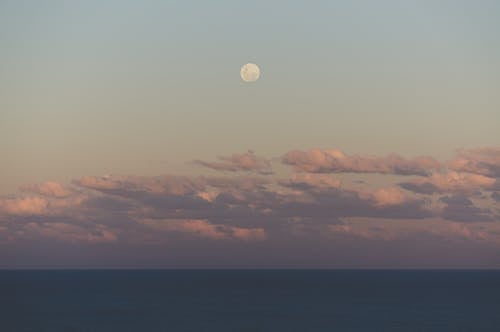 Free A Full Moon Across the Sky  Stock Photo