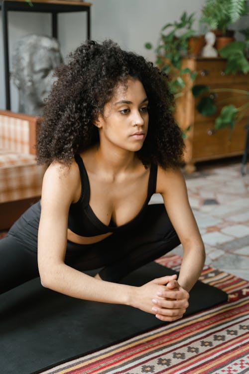 A Woman Doing Yoga at Home