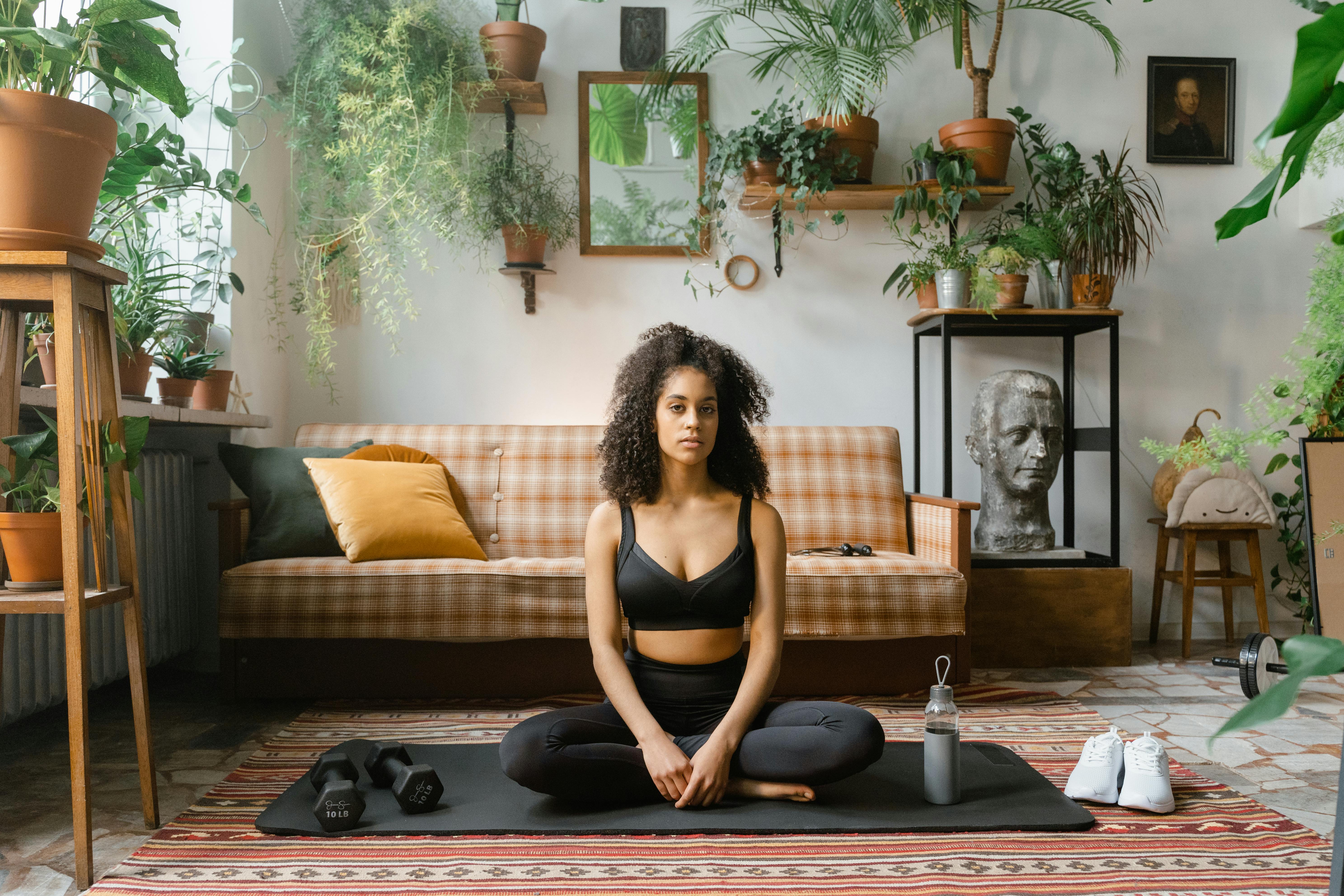 fit woman sitting on a yoga mat