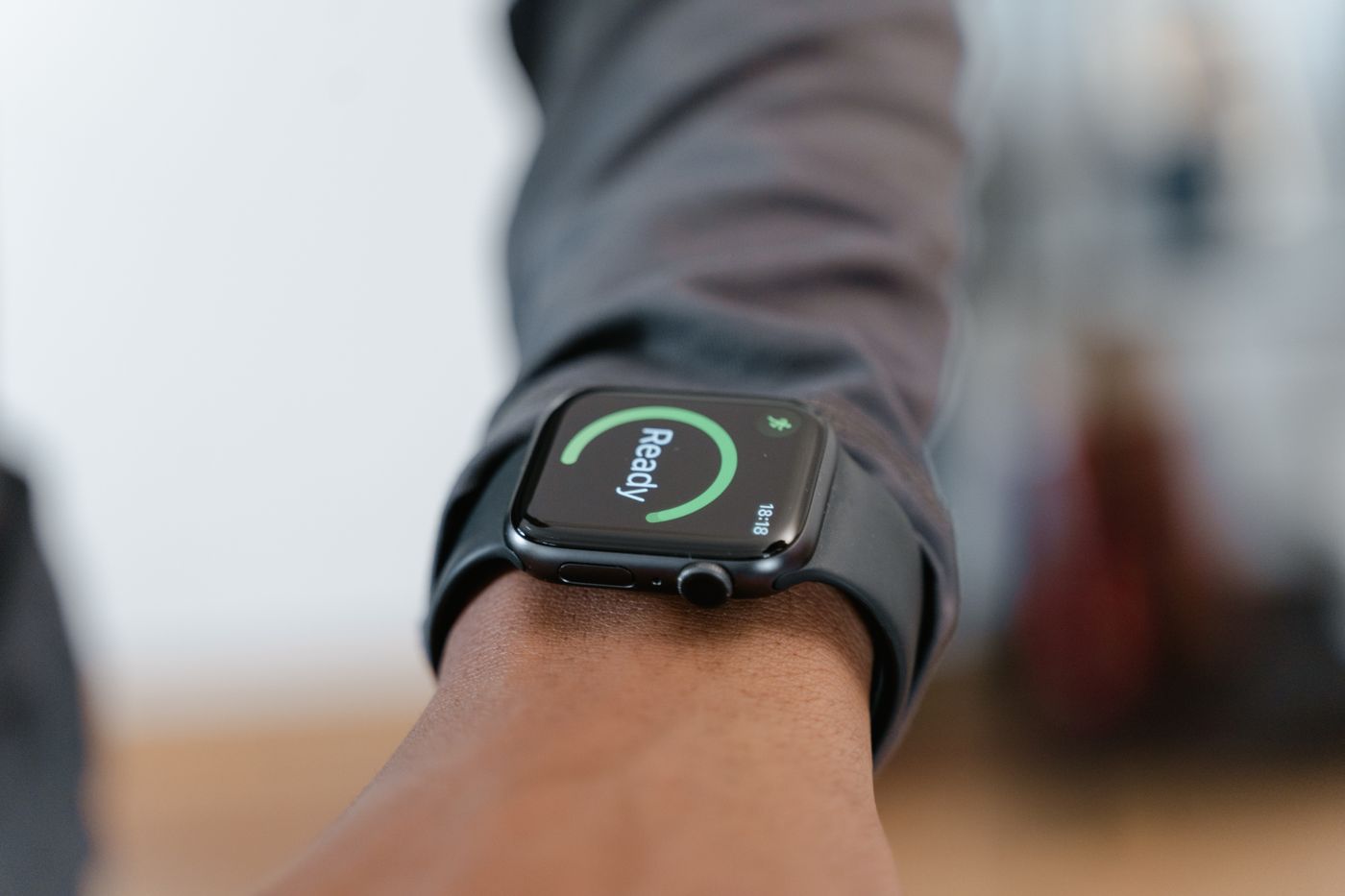 Person using a smartwatch during mobile device setup