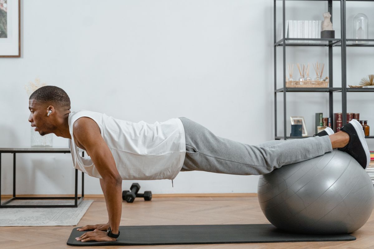 Man exercising with a stability ball for core and balance training