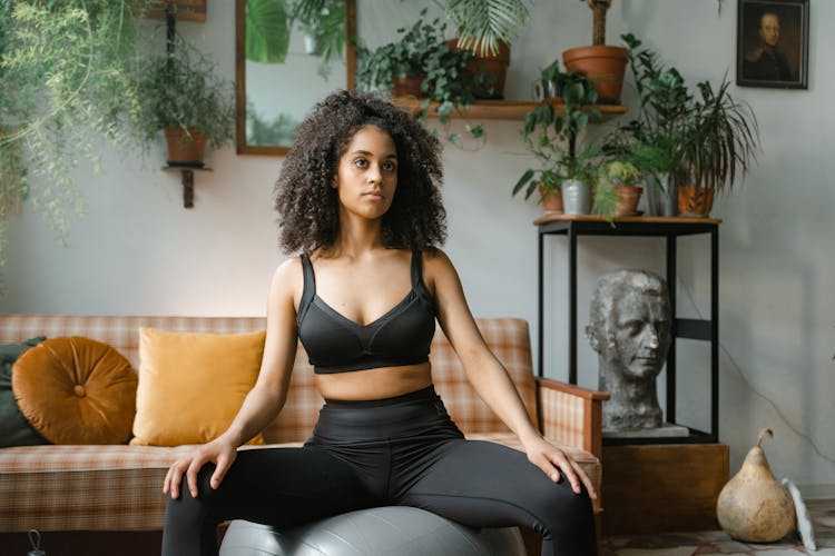 Woman Sitting On An Exercise Ball