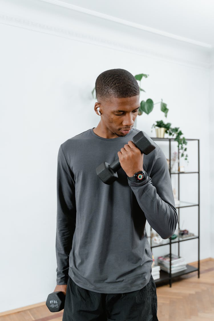 Photo Of A Man Using Dumbbells