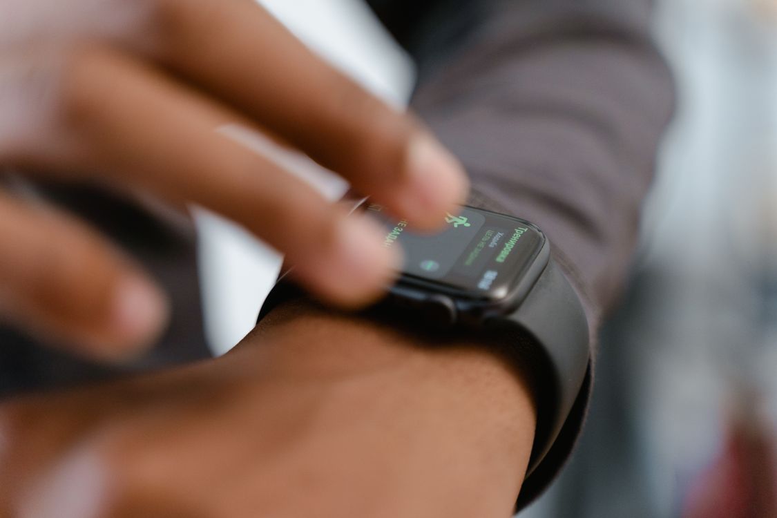 Someone Using A Smart Watch Person Wearing a Black Smart Watch · Free Stock Photo