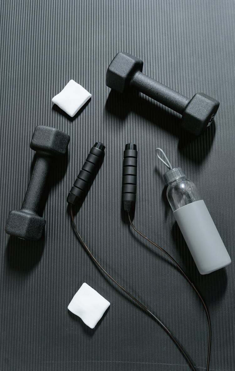 Exercise Equipment On Black Rubber Floor