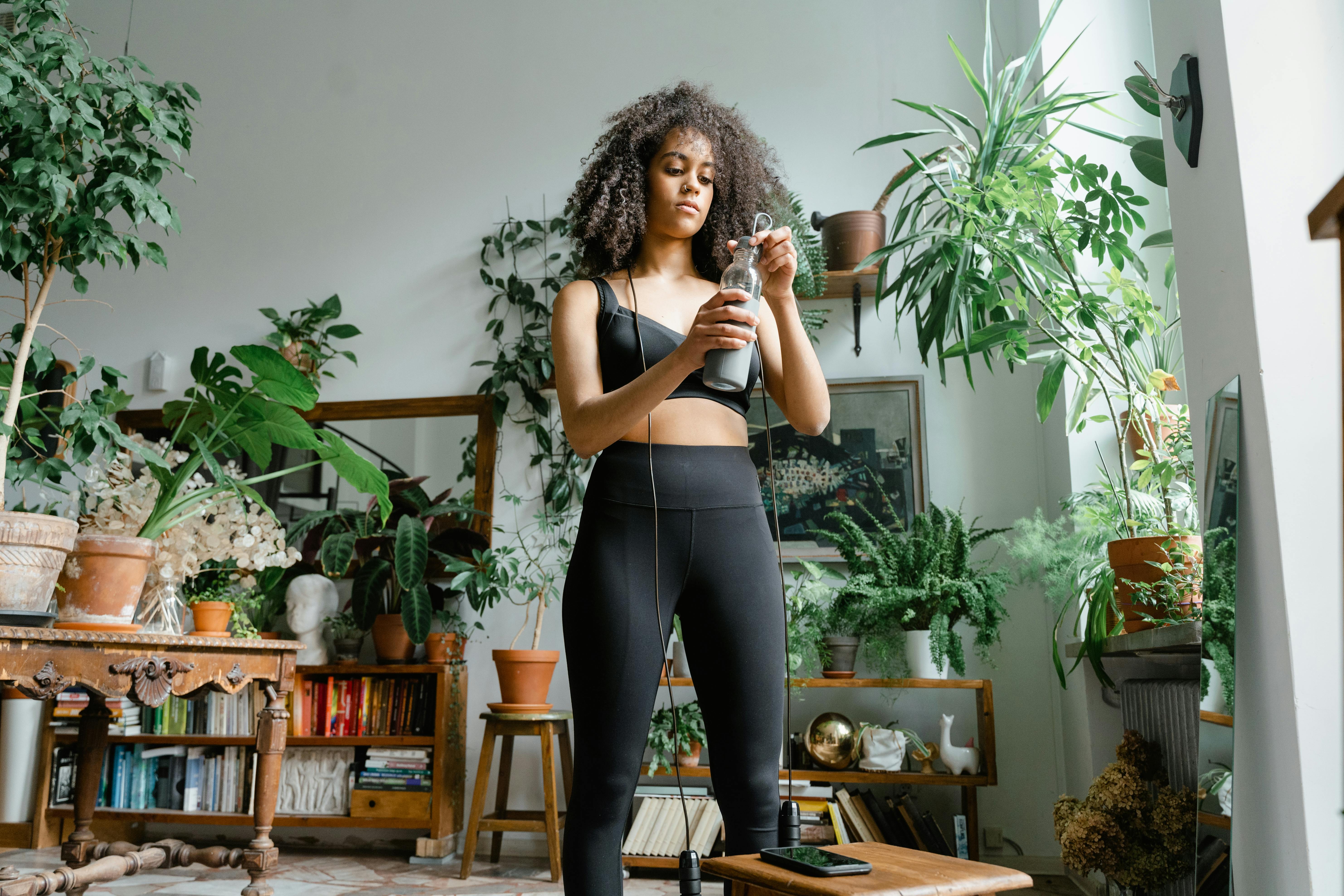 Woman Wearing a Black Workout Clothes · Free Stock Photo