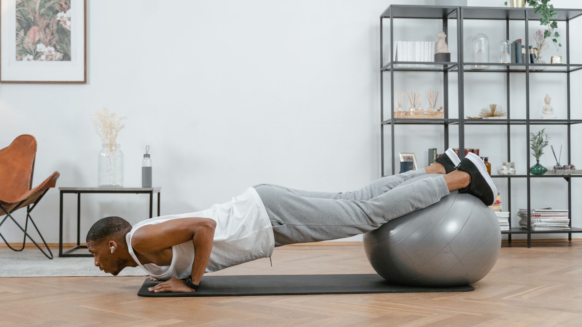 Ultimate Exercise Unlocking Guide: Boost Energy, Focus, and Performance Adult doing push-ups with an exercise ball indoors for fitness and health — ultimate exercise unlocking guide