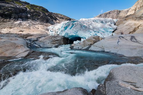 Free Explore the stunning glacier and flowing stream in Luster, Vestland, Norway. Stock Photo