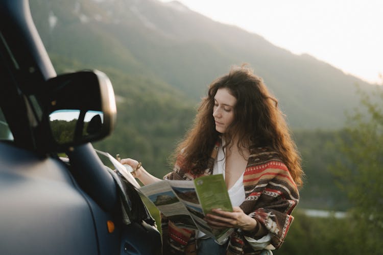 Woman Looking At A Brochure