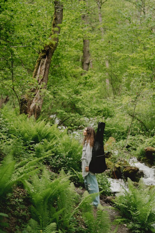 Free Woman Standing In The Woods Stock Photo