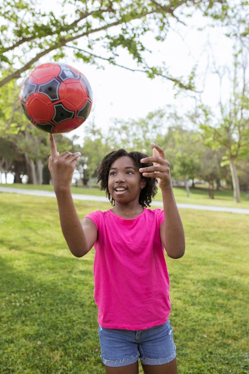 Young Girl Playing a Football