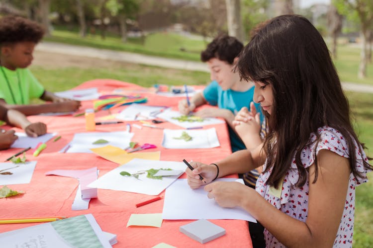 A Girl Drawing An Artwork