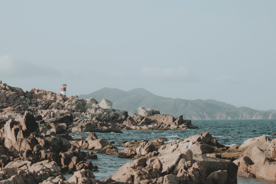 Lighthouse on Rocky Coastline