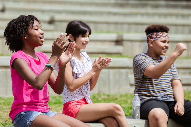 Happy Children Sitting Clapping 