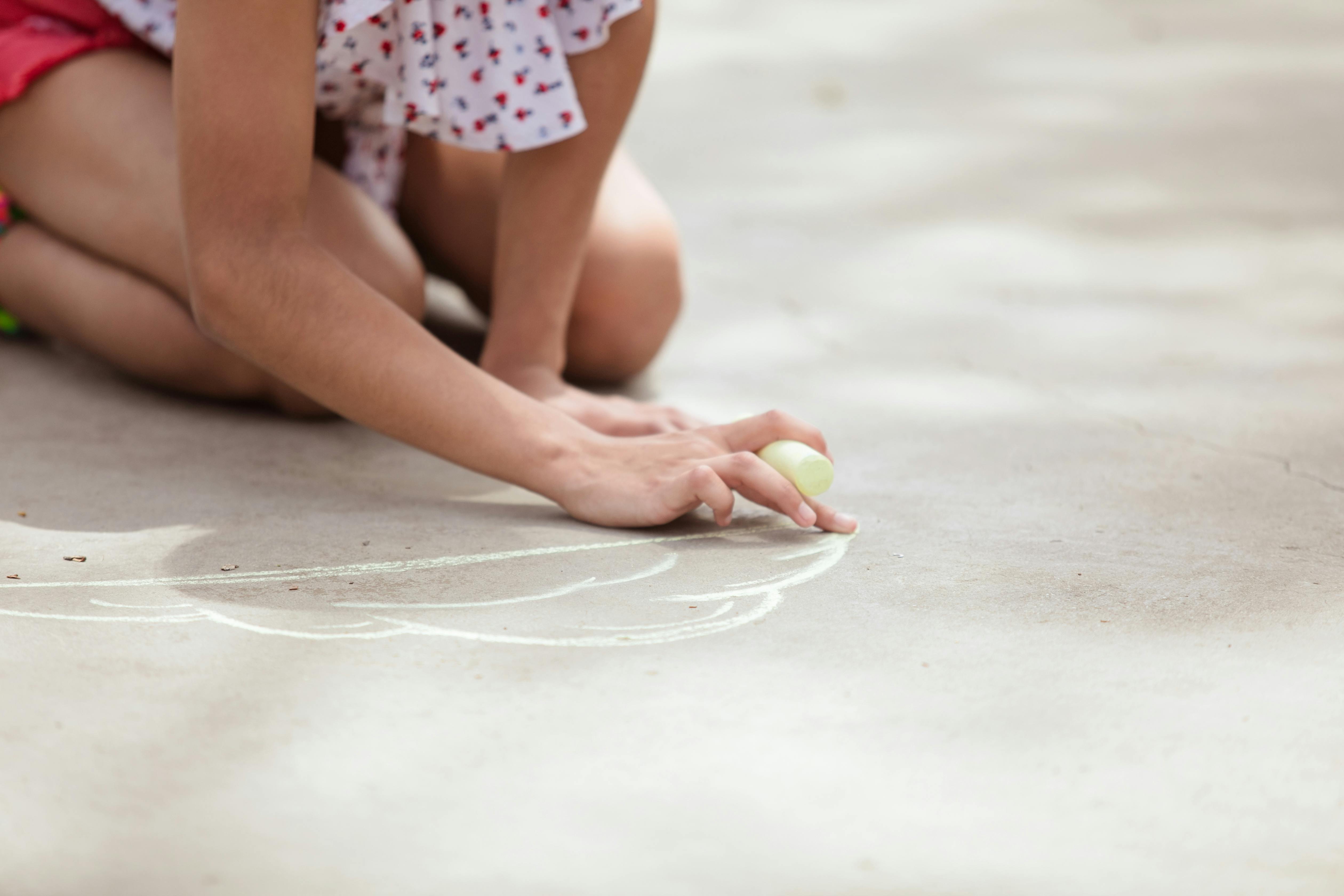 kid writing on the floor