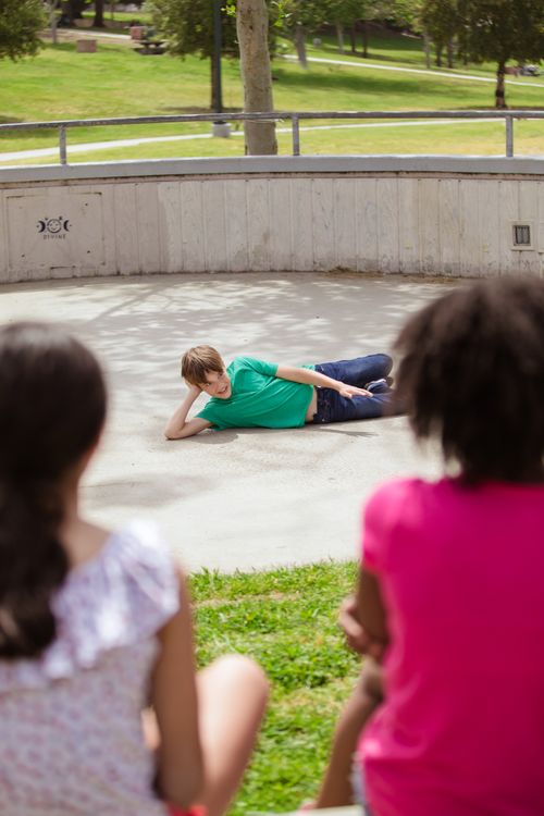 Free Teens enjoy leisure time at a sunny park with playful activities. Stock Photo