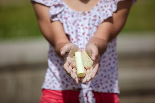 A Person Holding a Yellow Chalk