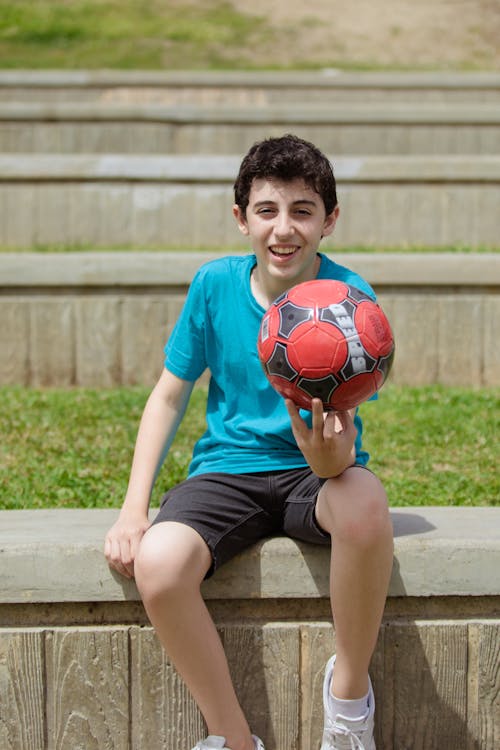 Free Boy Holding a Soccer Ball Stock Photo