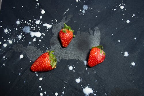 Free Red Strawberry on Black Textile Stock Photo