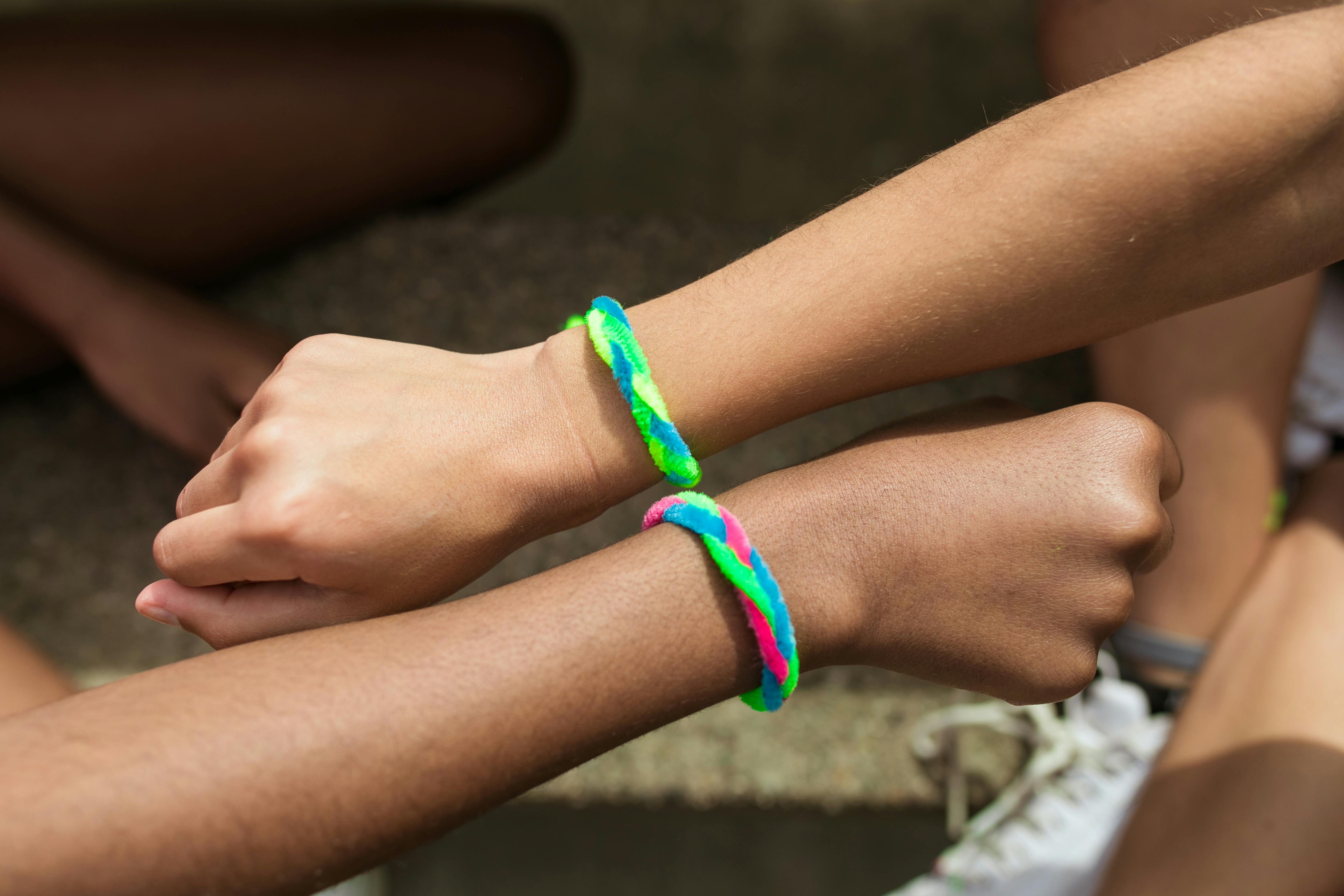 Premium Photo  A group of people wearing colorful bracelets hold hands