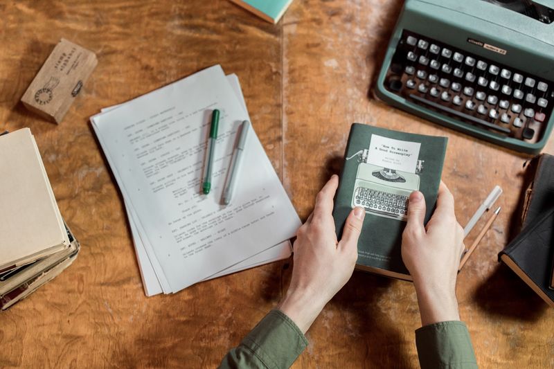 Vintage typewriter with manuscript pages — photo by Ron Lach on Pexels