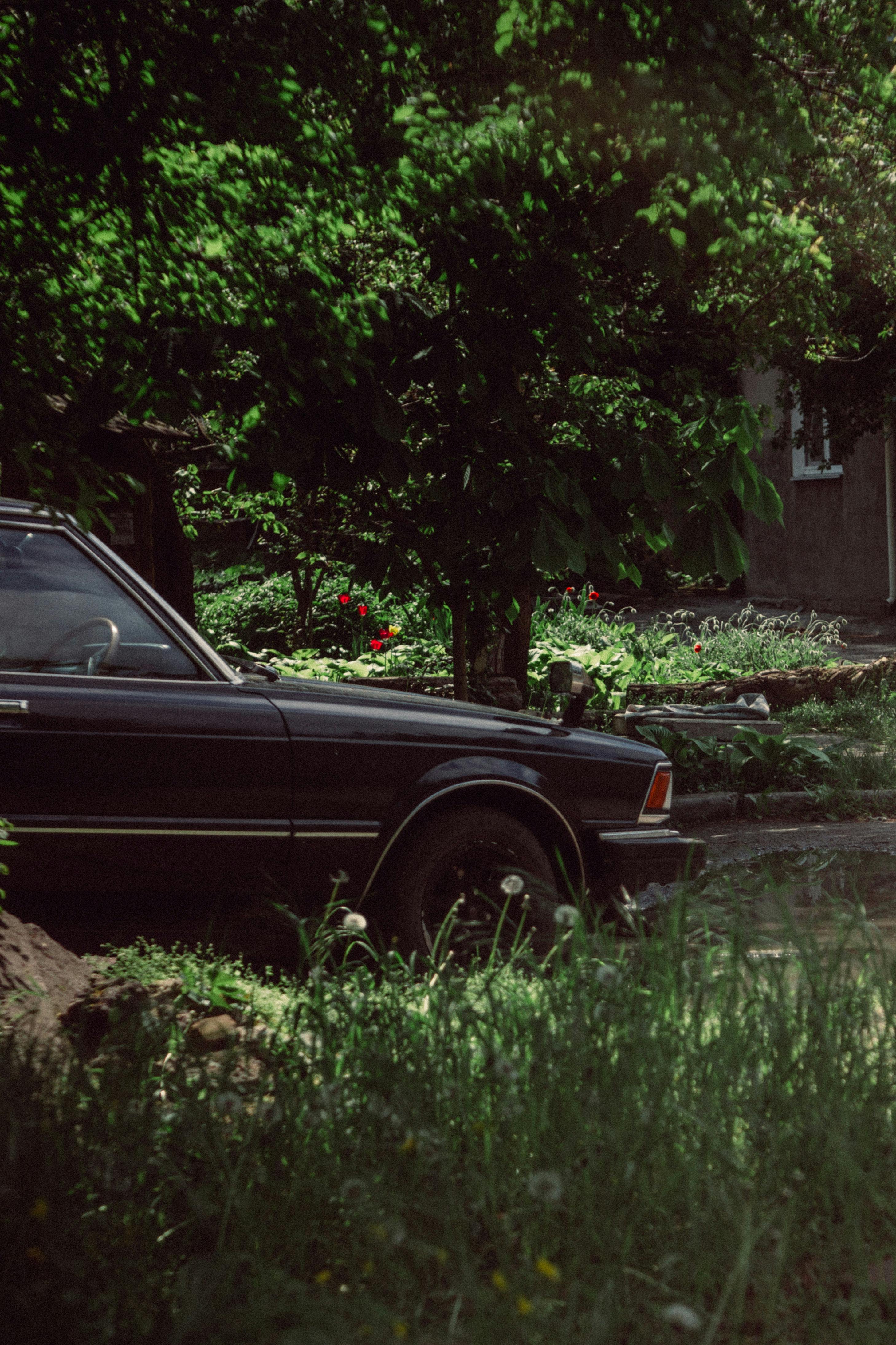 Retro car parked near house · Free Stock Photo