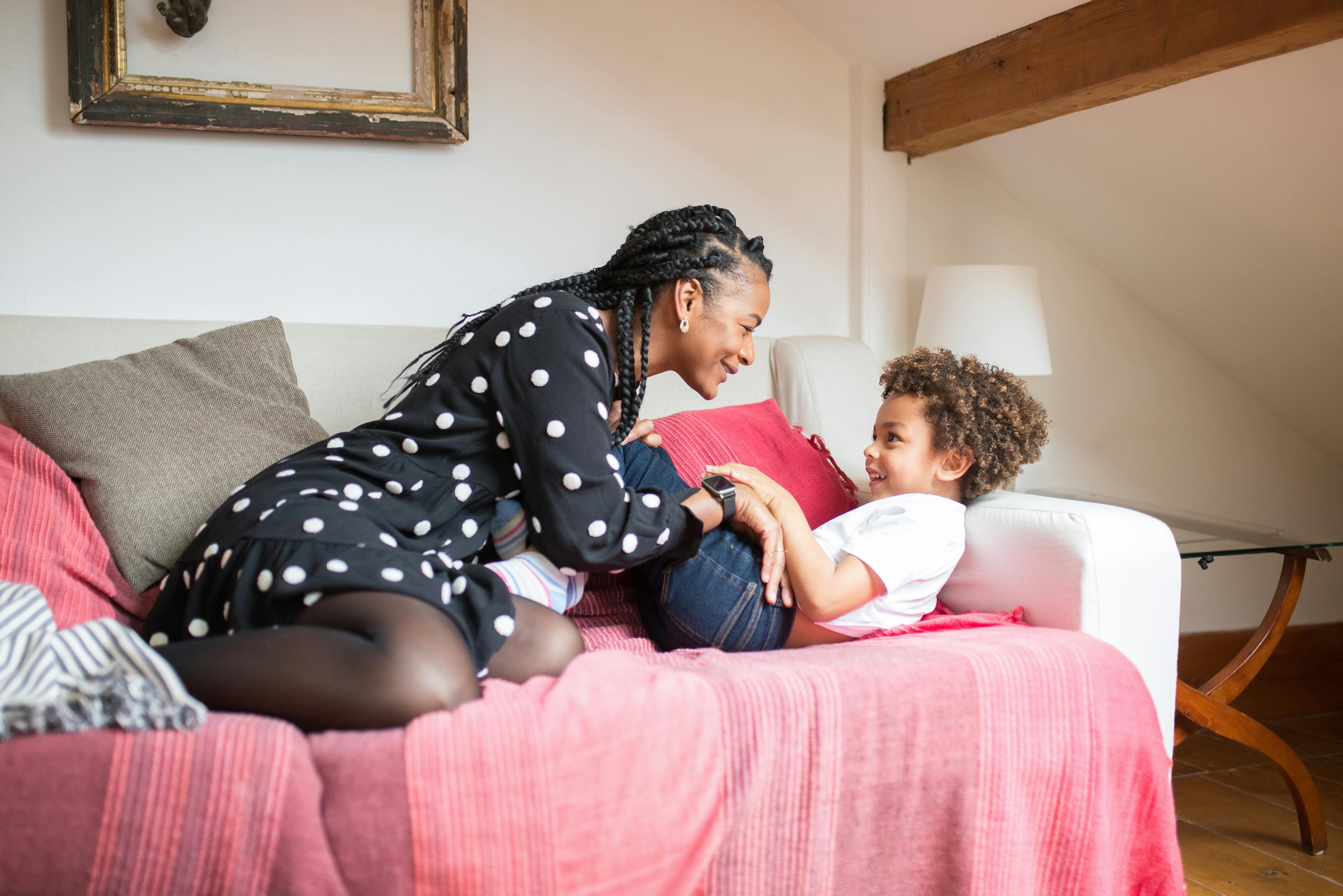 mother and son sitting on a couch