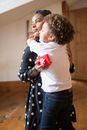 Child Giving Woman a Hug