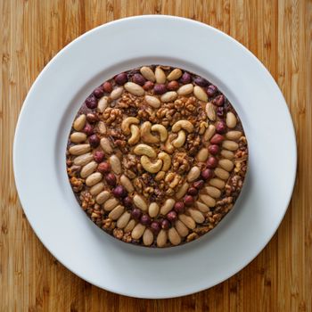 Round Cake with Nuts on White Ceramic Plate