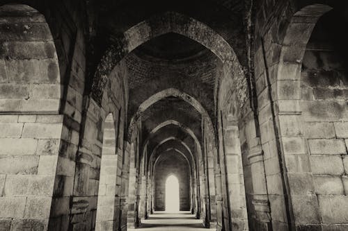 Grayscale Photo of a Hallway