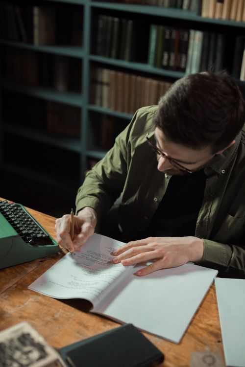 Writing a thesis chapter at a desk