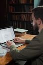Man Typing on Laptop
