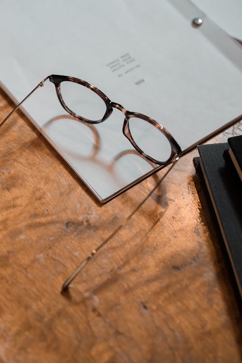 Black-Framed Eyeglasses on the Table