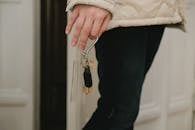 Hand of a Woman Holding Key