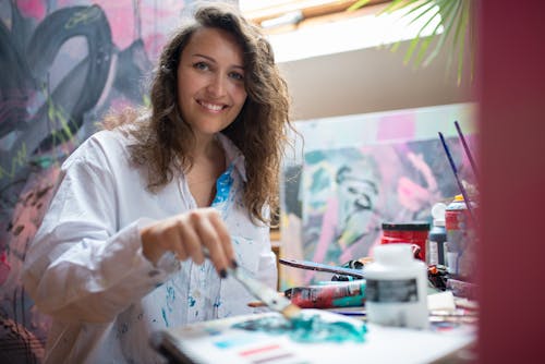 Free Happy Woman doing Painting Stock Photo