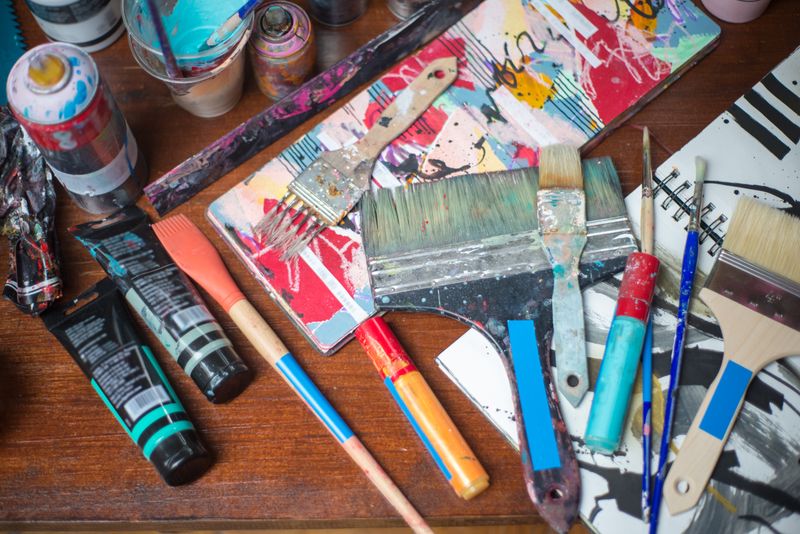 Colorful painting materials arranged on a table