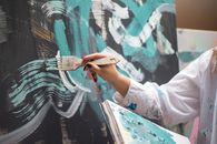 Person Painting on a Wall