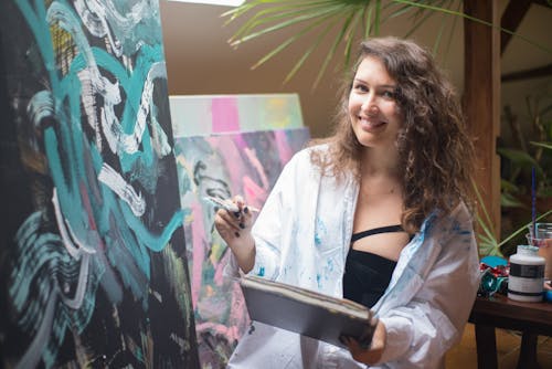 Free A Happy Woman doing Painting  Stock Photo