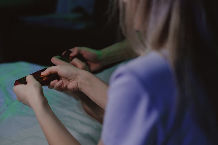 Woman Holding A Remote Control