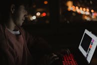 Young Man Using Laptop