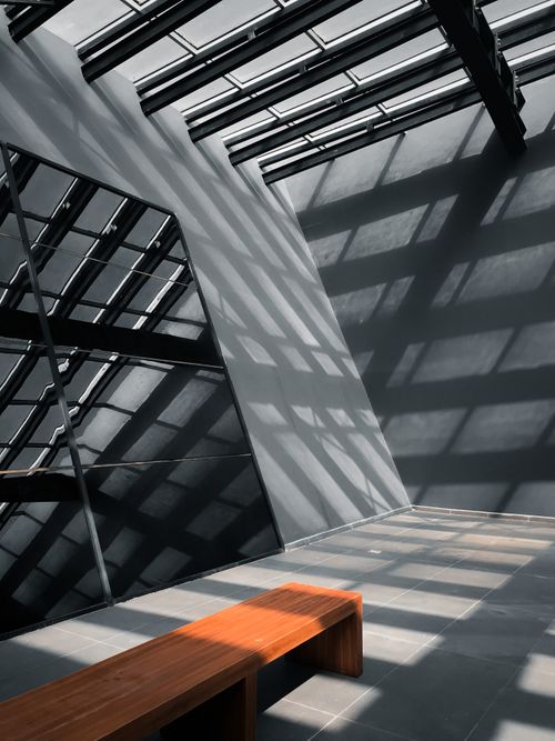 Free Explore the captivating play of light and shadows on a modern architectural interior. Stock Photo