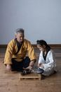 Man and Woman Sitting on Floor
