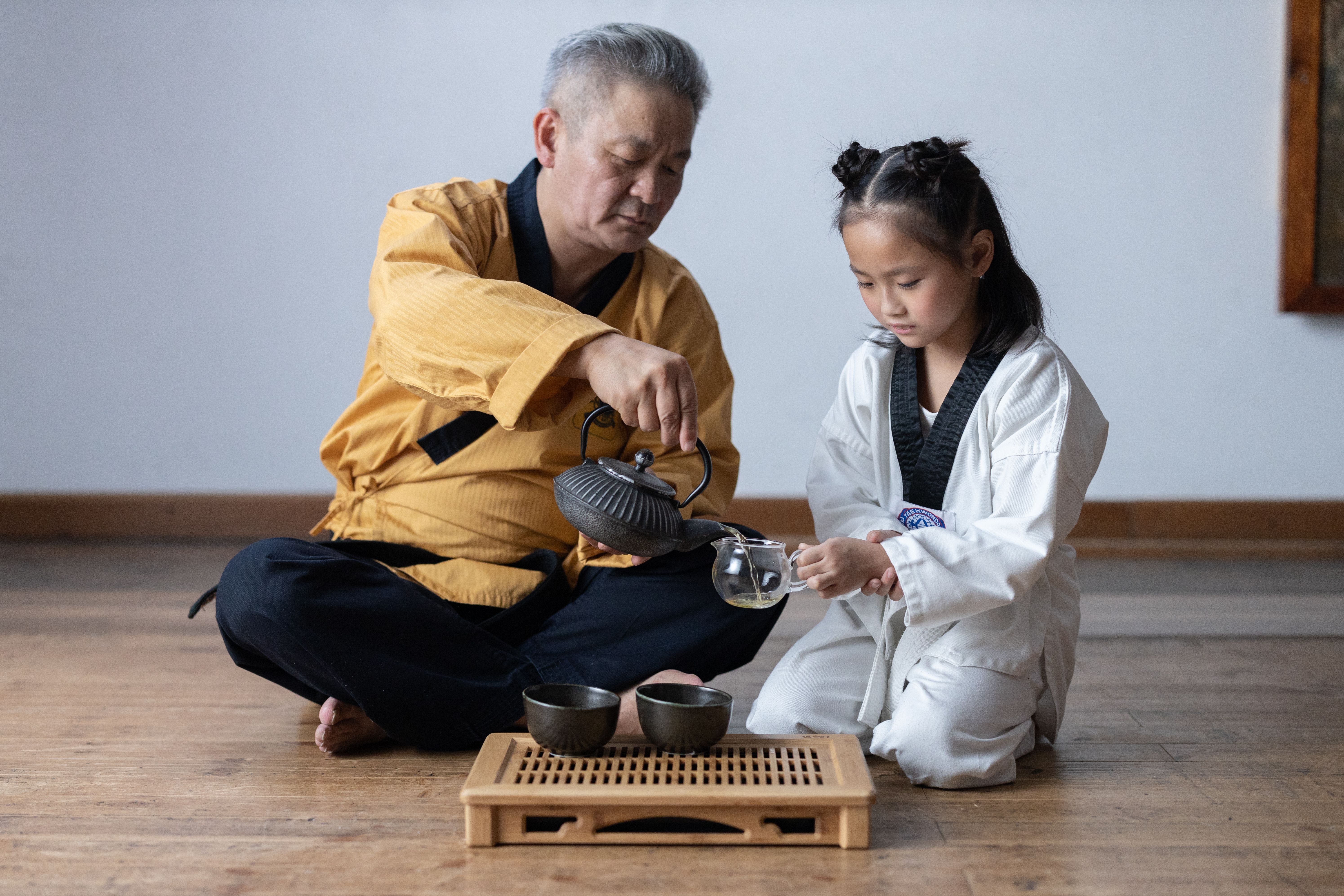 A serene scene of a traditional Korean tea ceremony, symbolizing respect and patience